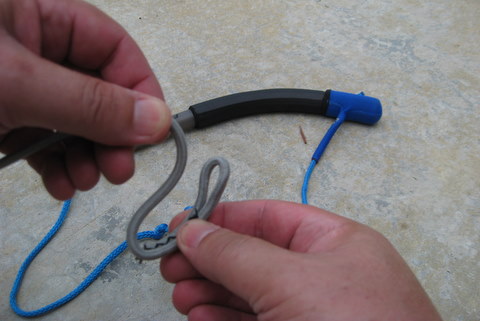 folding the leash back towards the loop in the end to start a larks head knot